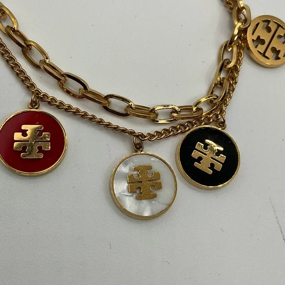 Tory Burch Gold Bracelet with Red, White, and Black Charms - Picture 2 of 5